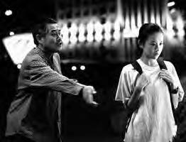 a man reaches out for a woman as she walks away