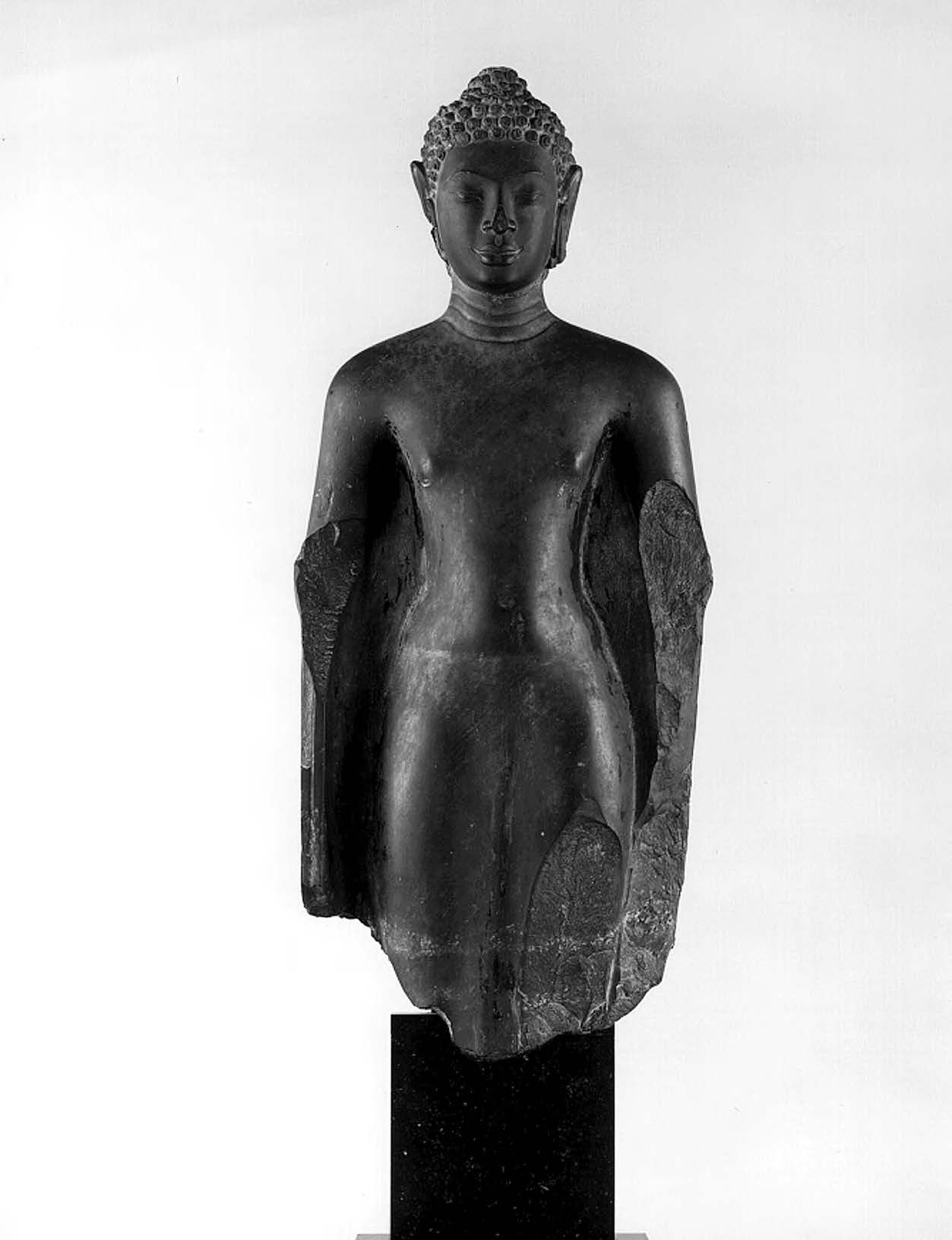 a statue of a man stands tall