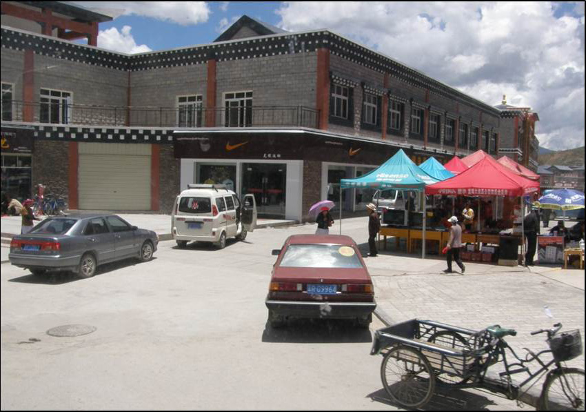 photo of cars parked in front of a store
