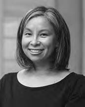 Lara C.W. Blanchard- a smiling middle aged woman with mid-length hair and wearing a black shirt.