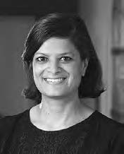 Marika Sardar- a smiling middle aged woman with mid-length hair and a black shirt. 