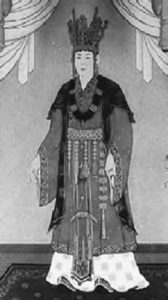 painting of a woman in elaborate robes, with a giant headdress. 