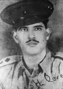 black and white photo of a mustached man with a military uniform