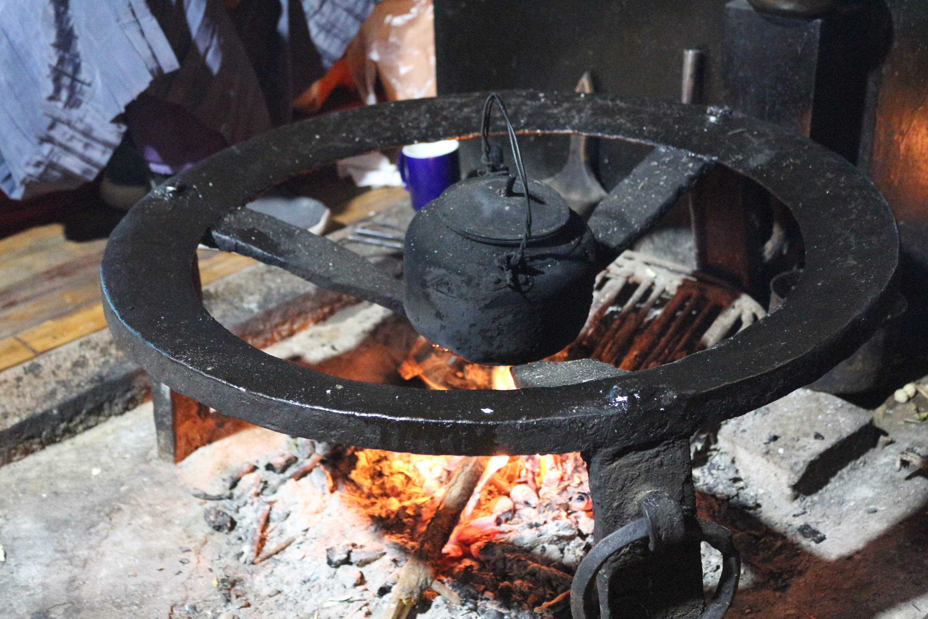  An iron tripod forms the center of the hearth in Mosuo households.
