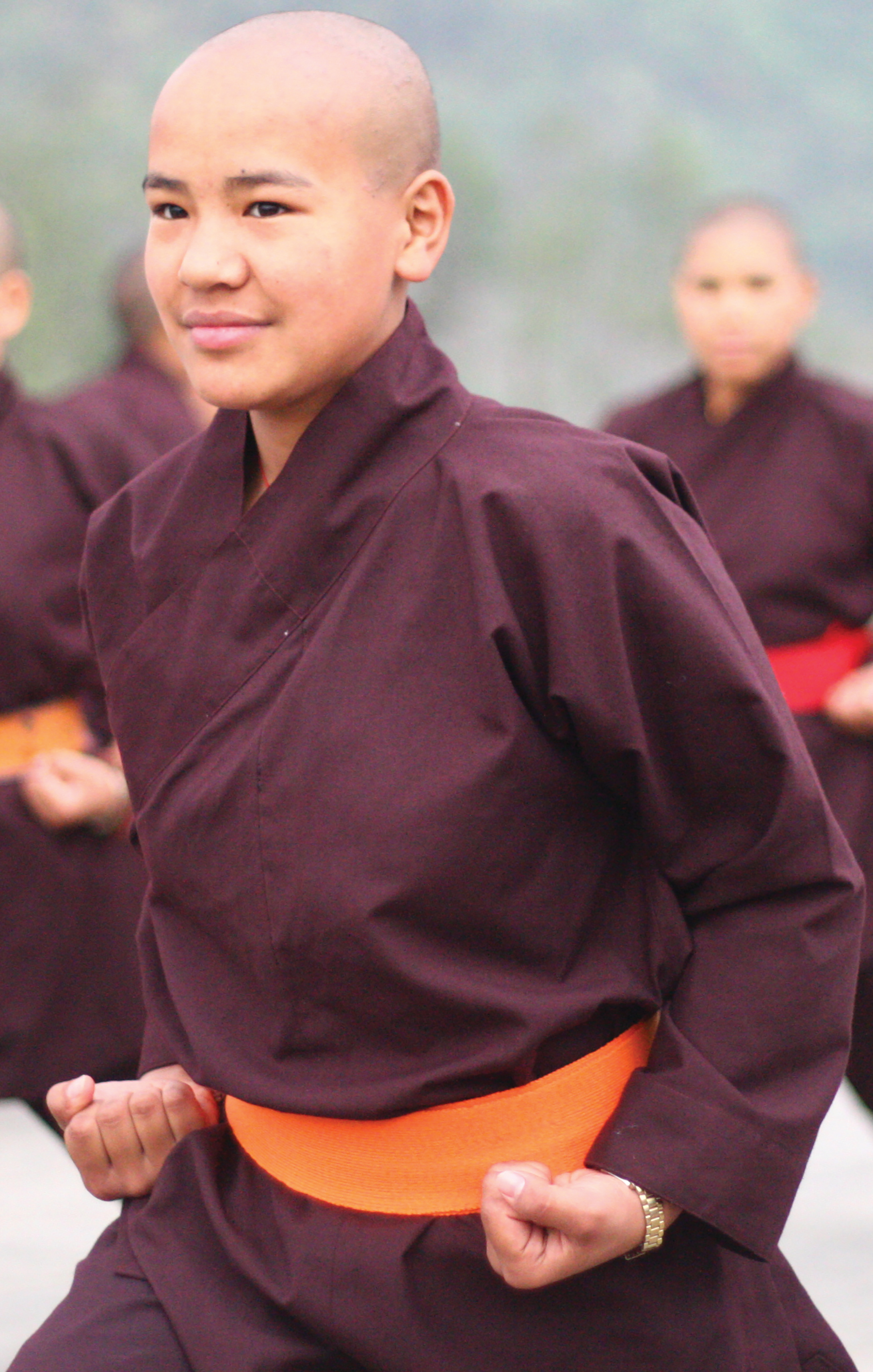 Buddhist nuns practicing kung fu self-defense.