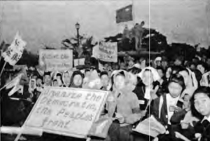 photo of a large group of women holding protest signs