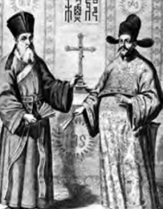 Picture of two men standing in front of the logo of the cross